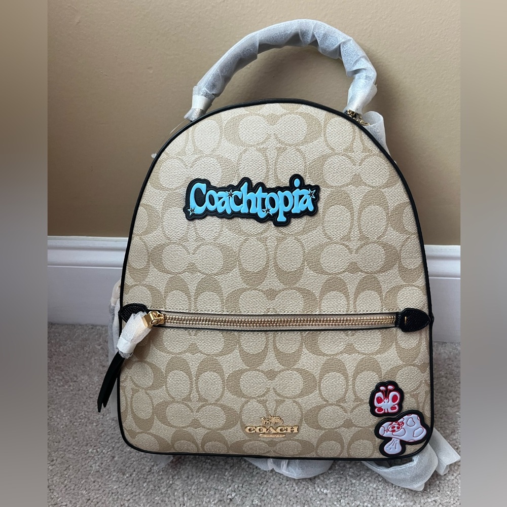 NWT Coach Sig Jordyn Backpack. Light Khaki and Brown with Coachtopia stickers